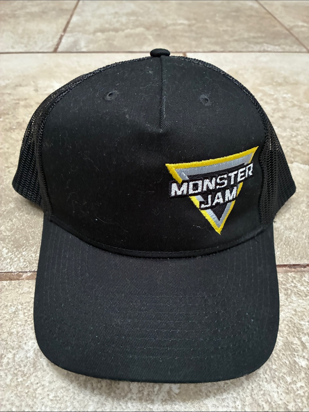 Port Authority Black Monster Jam Embroidered Trucker Hat with Yellow & Gray Logo